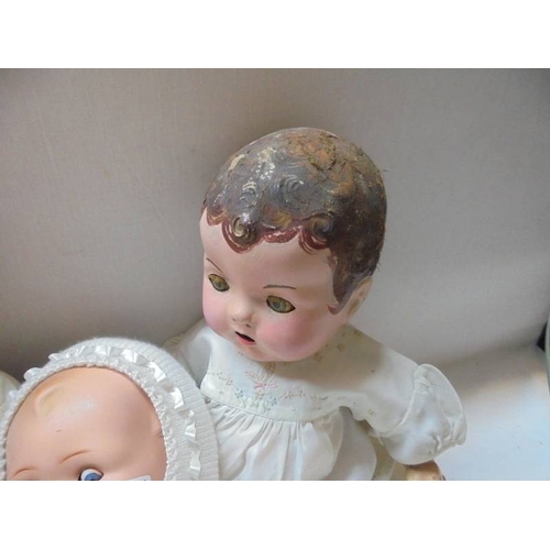 1335 - Five vintage composition dolls including some with porcelain heads.