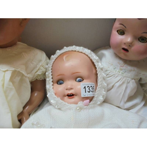 1335 - Five vintage composition dolls including some with porcelain heads.