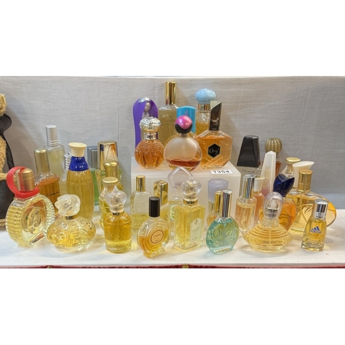 1354 - A good lot of perfume bottles with contents