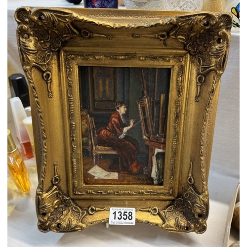 1358 - A gilt framed enhanced print of a lady painting