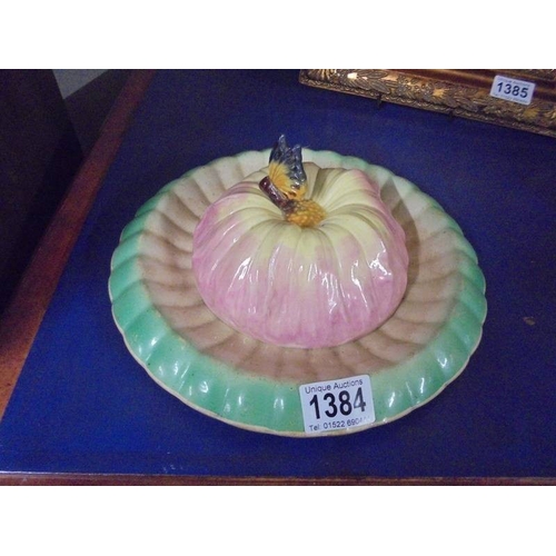 1384 - A vintage ceramic butter/cheese dish with lily pad base and flower head top with butterfly knob.