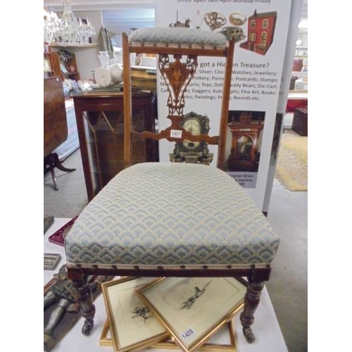 1407 - An Edwardian mahogany inlaid nursing chair.