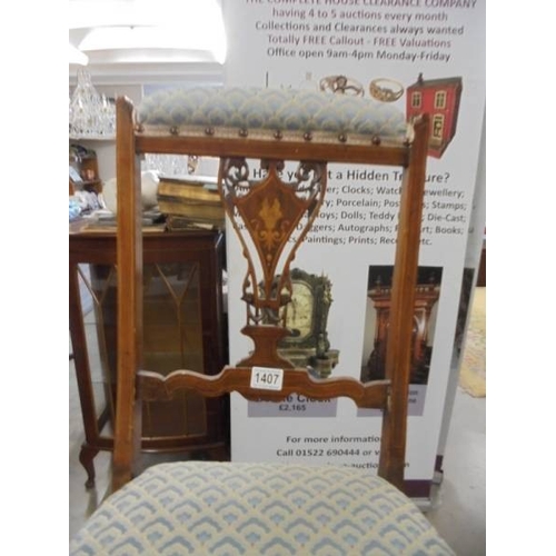 1407 - An Edwardian mahogany inlaid nursing chair.