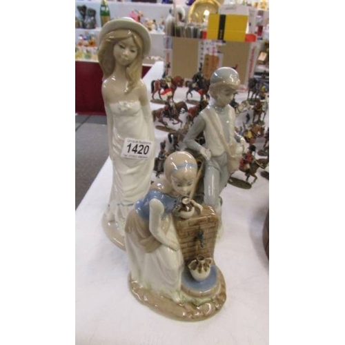 1420 - Three Lladro style figures.