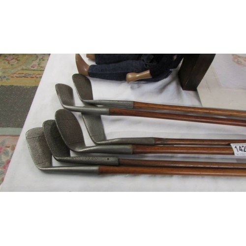 1429 - Six vintage golf clubs with wooden shafts including Ben Jayen etc.,