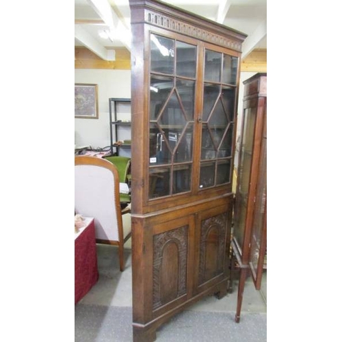 1434 - A good quality oak astragal glazed corner cabinet.