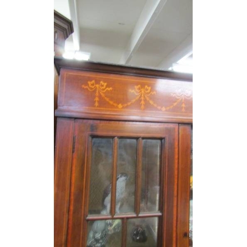 1435 - An Edwardian mahogany inlaid display cabinet.