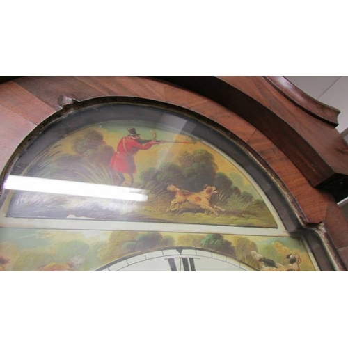 1440 - An oak cased 30 hour long case clock with painted dial featuring hunting scene marked Jas Iddison, K... 