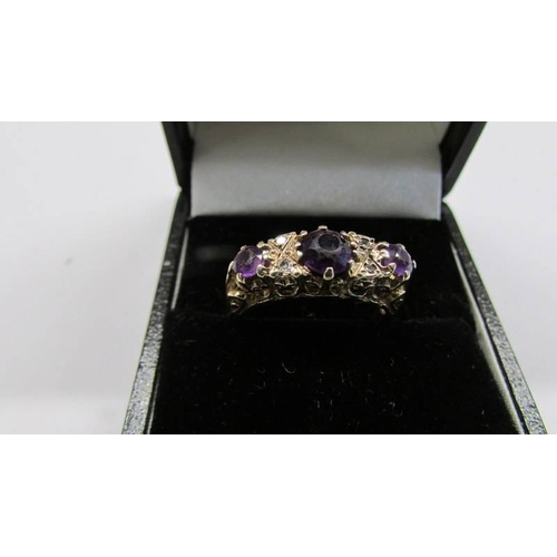 1066 - A diamond and amethyst vintage ring in 9ct gold, size L, 2.97 grams.