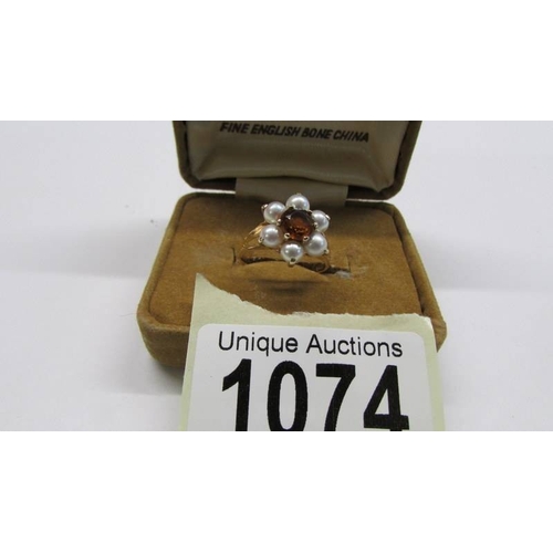 1074 - A vintage citrine and pearl cluster ring, openwork shoulders, 9ct gold, size M half, 2.52 grams.