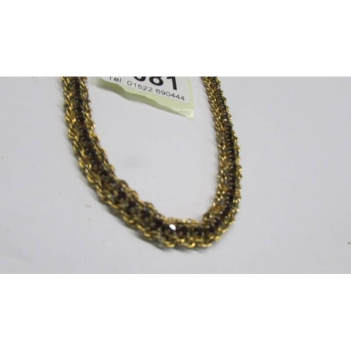 1081 - A vintage yellow metal necklace with citrine coloured stones.