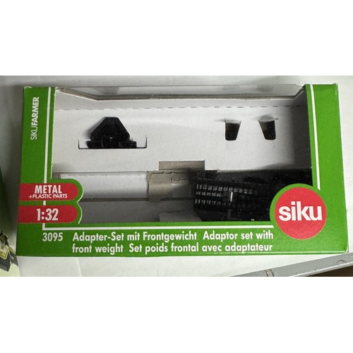 1444 - 7 boxed Siku agricultural vehicles Nos. 3255, 3052, 2066, 2469, 2265, 2456 and 3095.