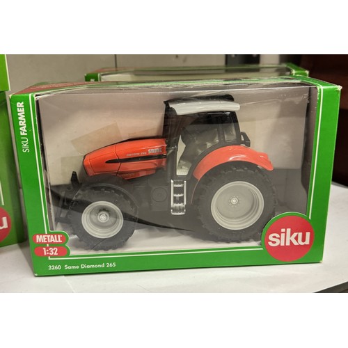 1446 - 7 boxed Siku agricultural vehicles Nos. 3260, 2450, 3058, 2070, 1960, 2065 and 2071.