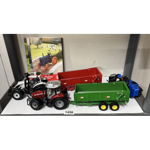 1456 - A quantity of unboxed Britains/Ertl agricultural vehicles including tractors, two shelves.