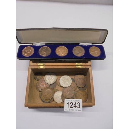 1243 - A mixed lot of coins including cased set of copper pennies.