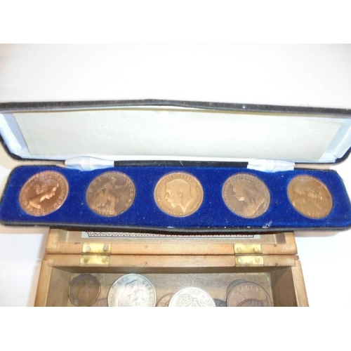 1243 - A mixed lot of coins including cased set of copper pennies.