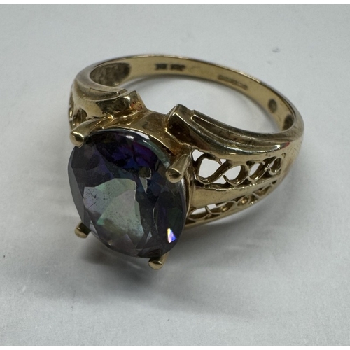 1100G - A 9ct gold ring set pale blue stone. Size T half. 5.13 grams