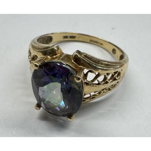 1100G - A 9ct gold ring set pale blue stone. Size T half. 5.13 grams