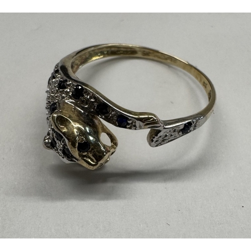 1100N - A 9ct gold leopard ring. Size P, 2.22 grams