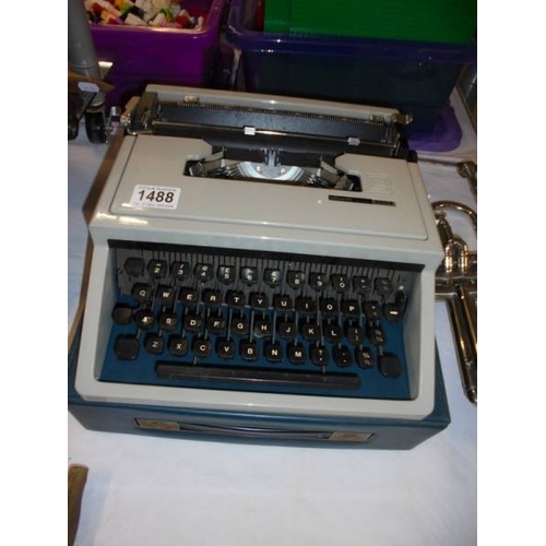 1488 - A cased Olivetti Dora typewriter.