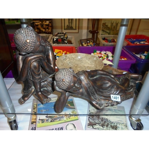 1491 - Two Resin Buddha's, a marble bowl and a John Perry dolphin figure.