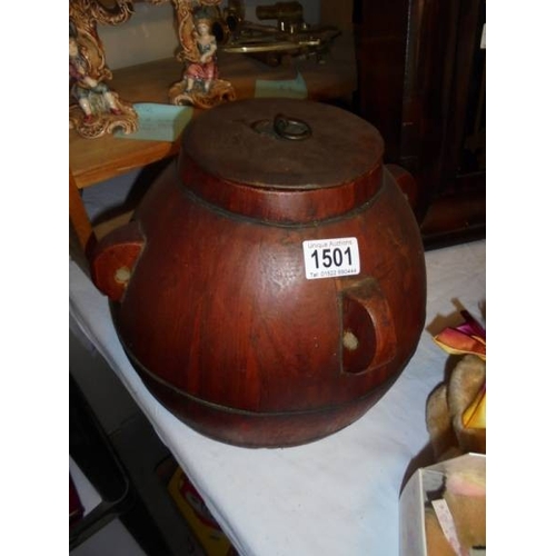 1501 - An oriental wooden rice storage jar.