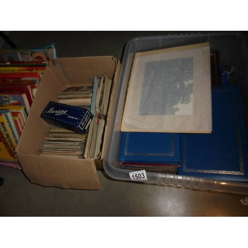 1503 - Two boxes of assorted postcards, pictures etc.,