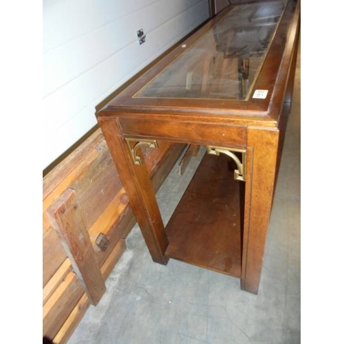 1518 - A good quality contemporary mahogany side table with glass top.