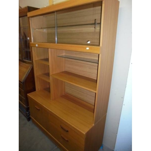 1519 - A modern teak wall unit.