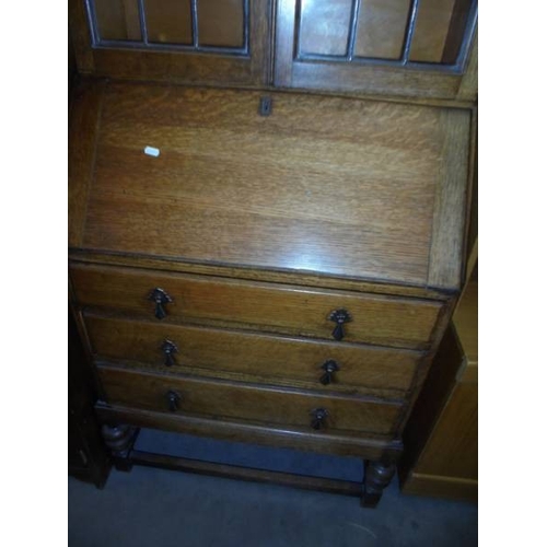 1520 - A good oak lead glazed bureau bookcase.