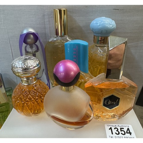 1354 - A good lot of perfume bottles with contents