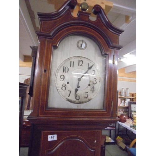 1561 - A mahogany inlaid long case clock with silvered dial and Westminster chime.