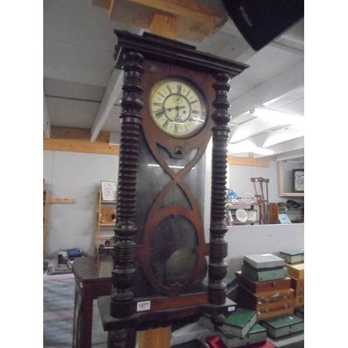 1577 - A double regulator wall clock with key, pendulum and weights.