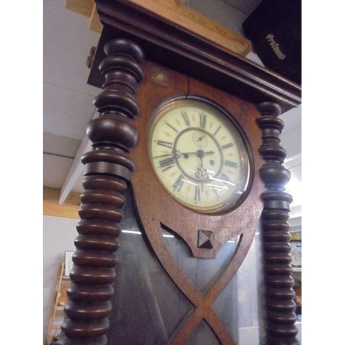 1577 - A double regulator wall clock with key, pendulum and weights.