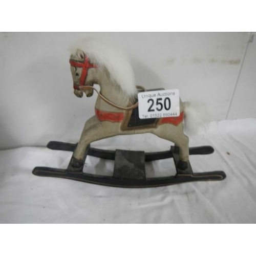 250 - A miniature rocking horse.