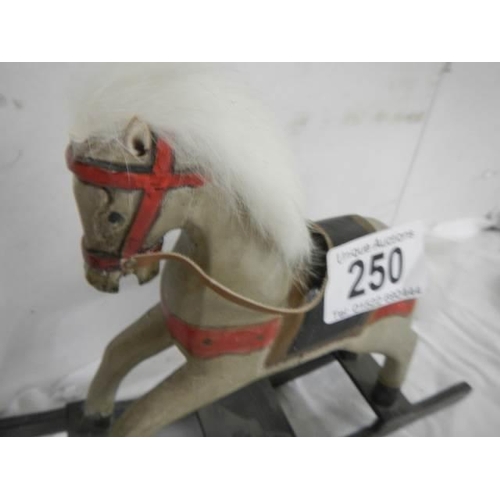 250 - A miniature rocking horse.