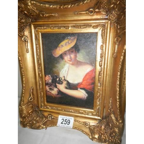 259 - A gilt framed study of a lady.
