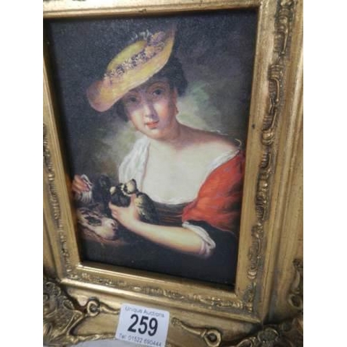 259 - A gilt framed study of a lady.