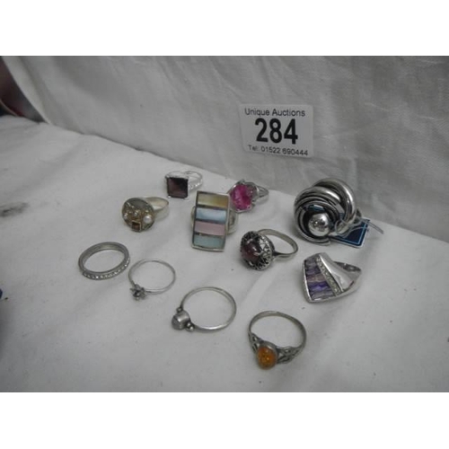 284 - Twelve assorted dress rings.