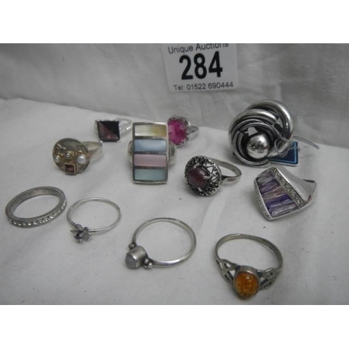 284 - Twelve assorted dress rings.