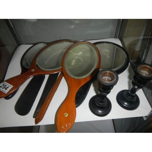 294 - A quantity of old hand mirrors, candlestick etc.