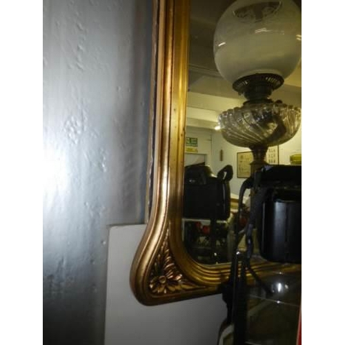 11 - A gilt framed arched top mirror.