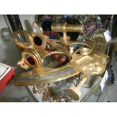 14 - A brass sextant.