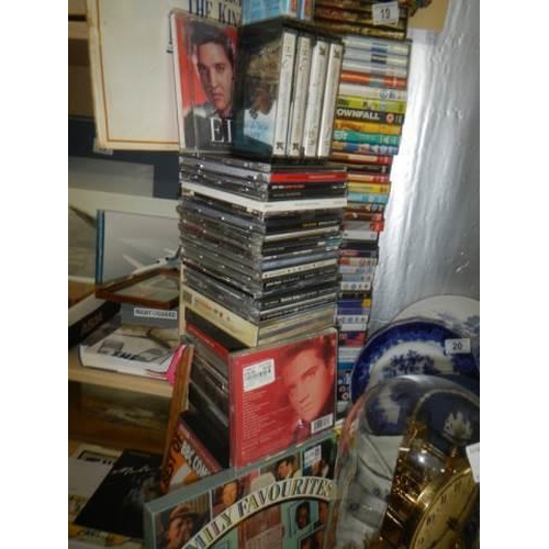 19 - A quantity of CD's, DVD's and cassette tapes.