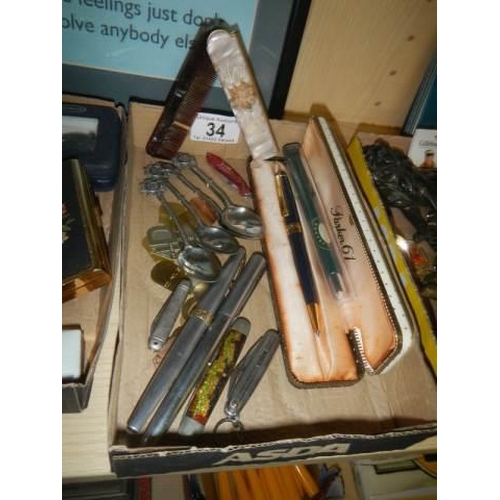 34 - A mixed lot including fountain pens, souvenir spoons etc.,