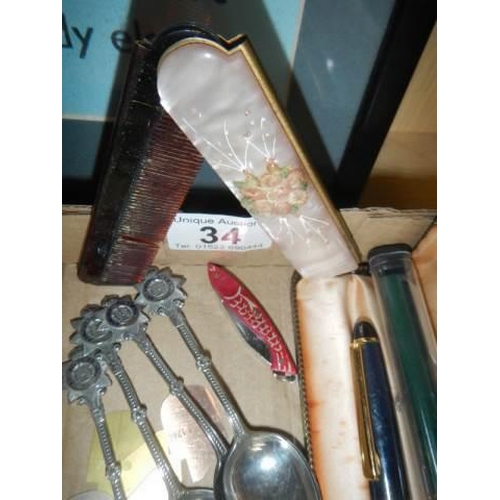 34 - A mixed lot including fountain pens, souvenir spoons etc.,
