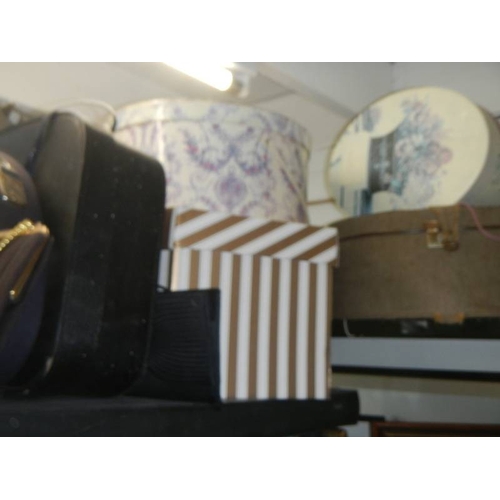 57 - A quantity of vintage hats, hat boxes and hand bags.