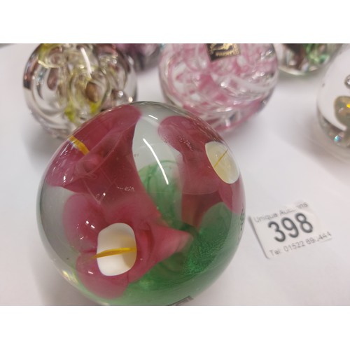 398 - 7 Langham paperweights