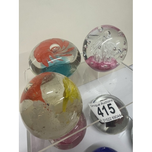 415 - 8 Mixed paperweights