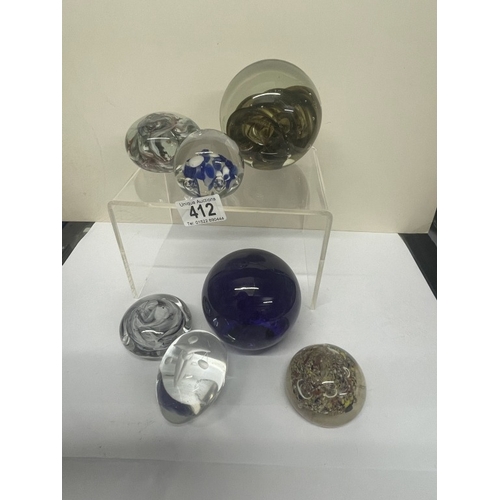 412 - A quantity of mixed paperweights including 1 Scales of justice